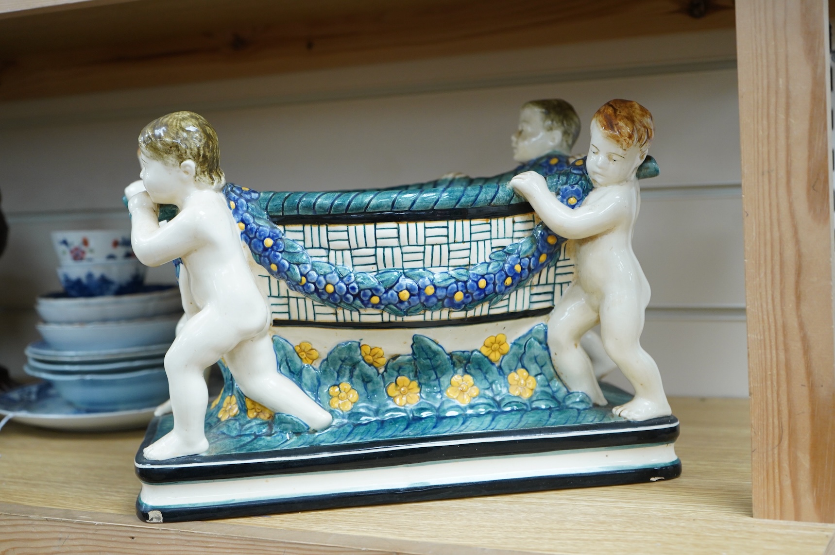 A Karlsruhe jardiniere with four putti designed by Wilhelm Süs in 1908, model number 1002, 33cm wide